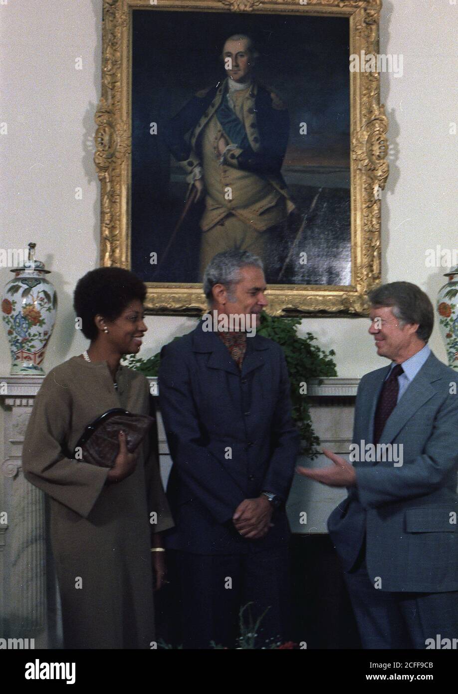 "Mrs. Michael Manley, Prime Minister Michael Manley and Jimmy Carter during an Oval Office meeting. ca.  12/16/1977" Stock Photo