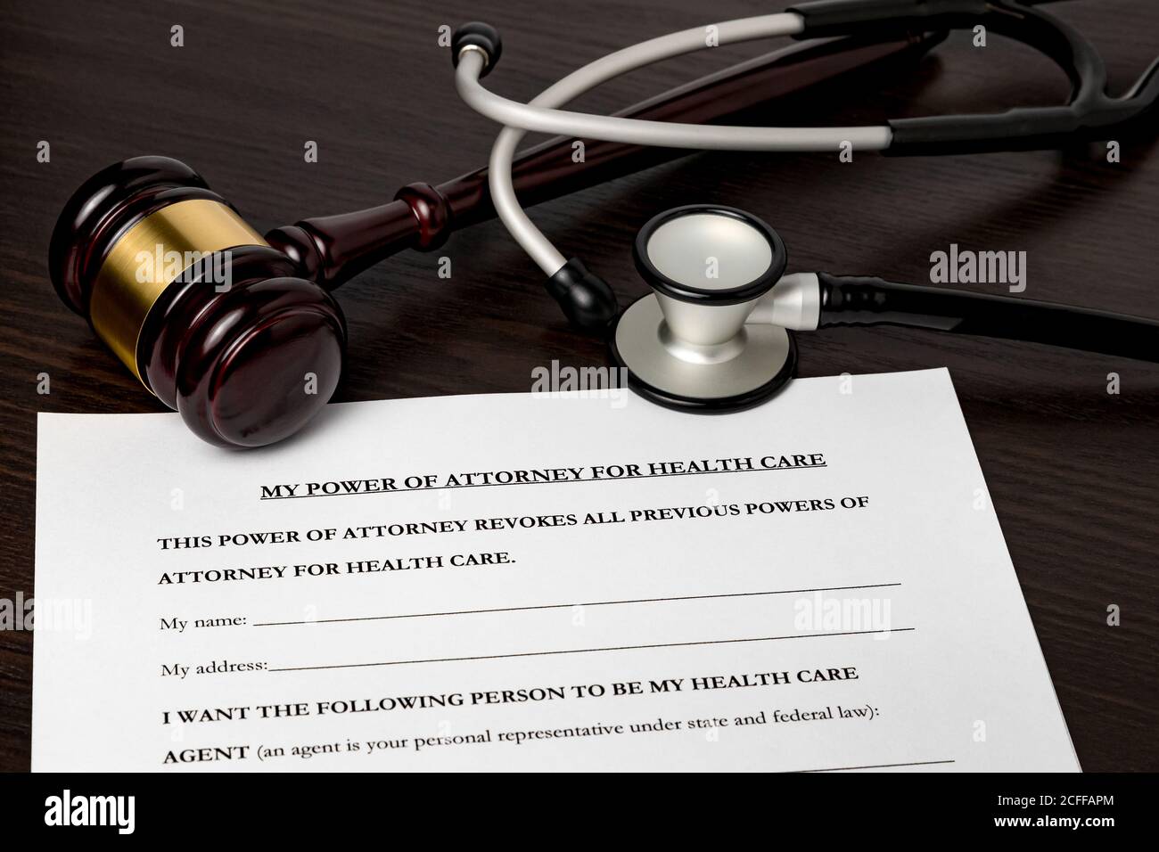 Power of Attorney for health care, HCPA, with gavel and stethoscope. Concept of planning for death, final wishes, terminal illness, and advance direct Stock Photo