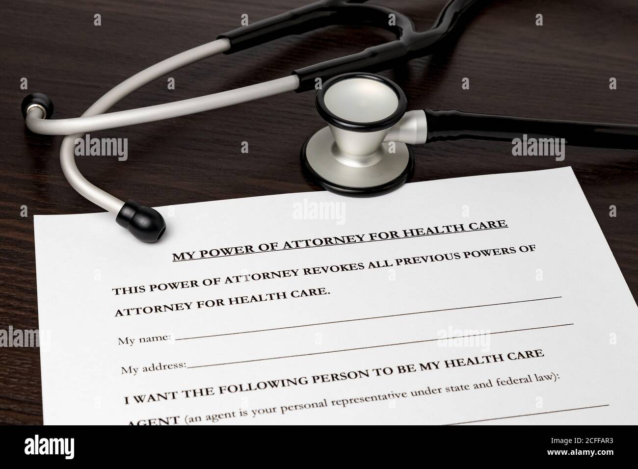 Power of Attorney for health care, HCPA, with stethoscope. Concept of planning for death, final wishes, terminal illness, and advance directive during Stock Photo