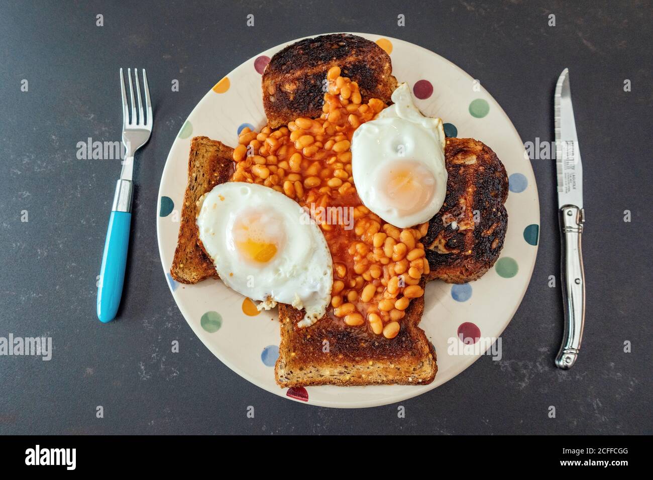 Baked beans on toast with fried egg hires stock photography and images