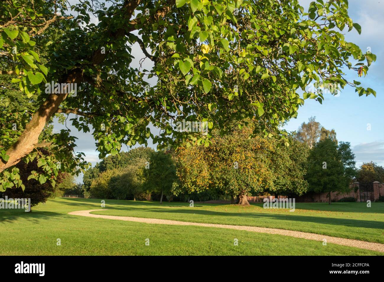 Country House garden with winding gravel path Stock Photo