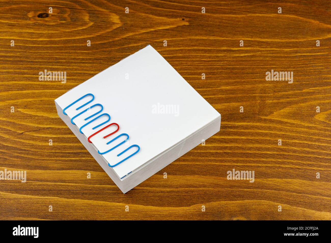 Paper clips staple on a pad Stock Photo Alamy