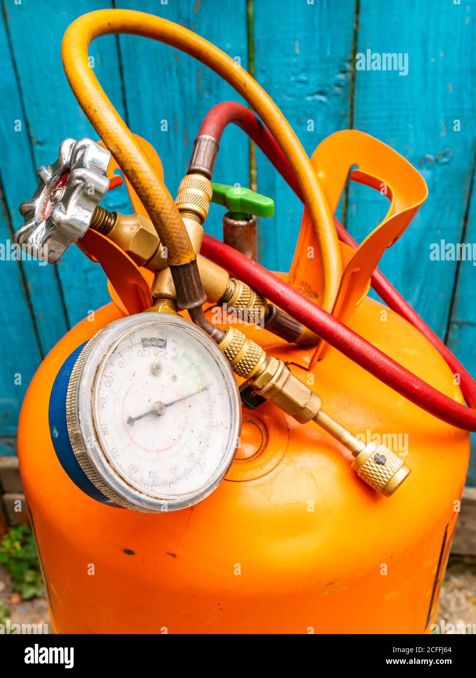 Refrigerant cylinder and hoses with pressure gauge Stock Photo Alamy