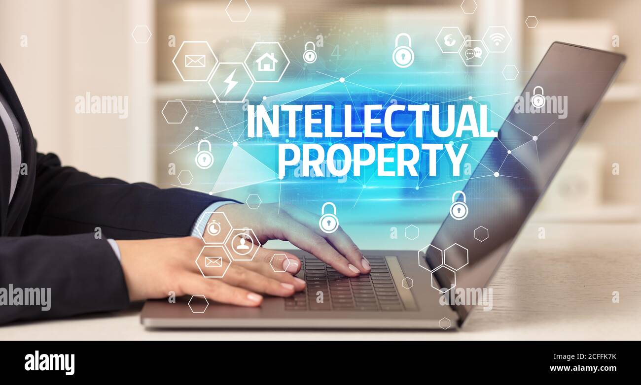INTELLECTUAL PROPERTY inscription on laptop, internet security and data ...