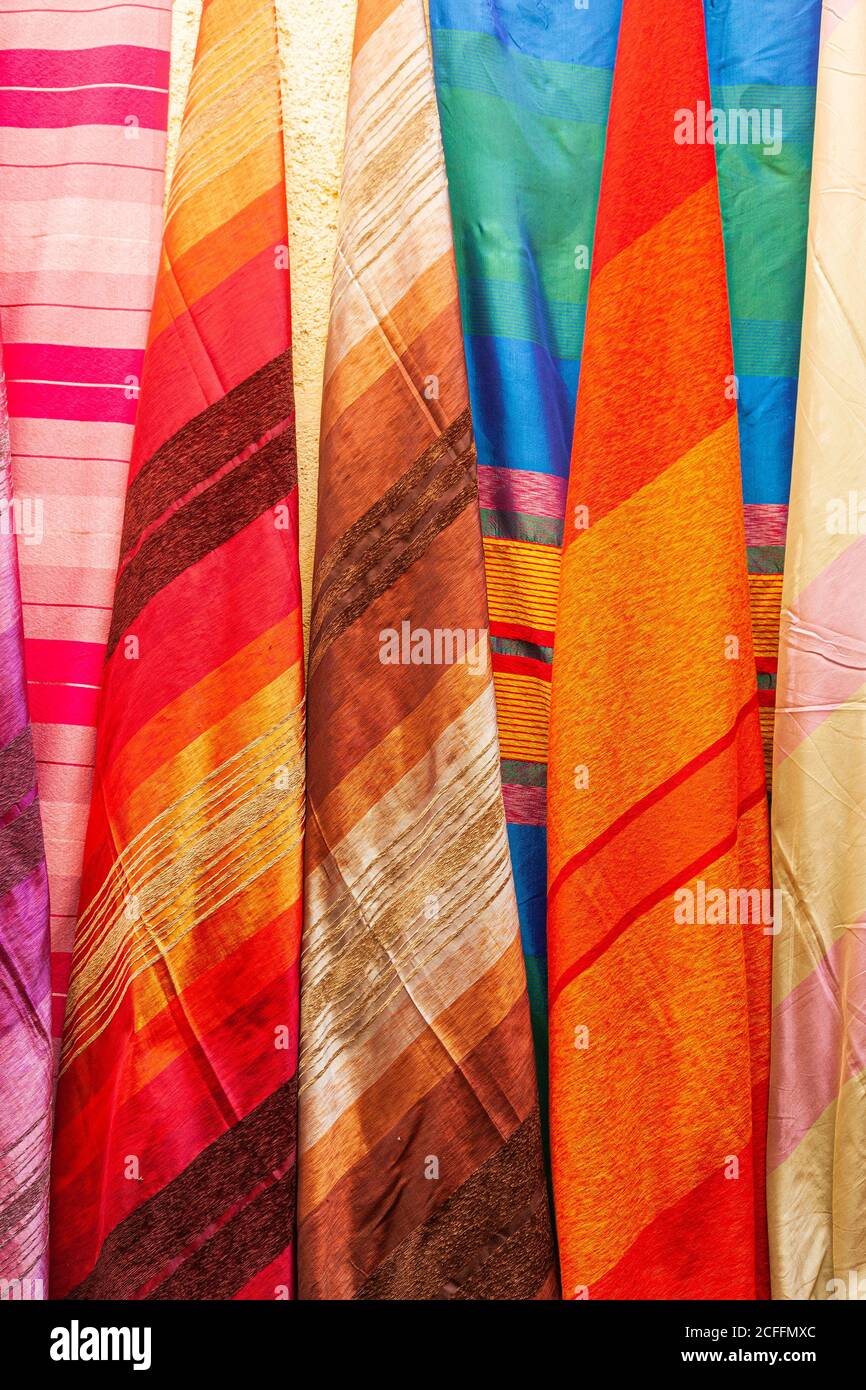 Selection of colourful cloth at a market stall in Fez, Morocco Stock Photo