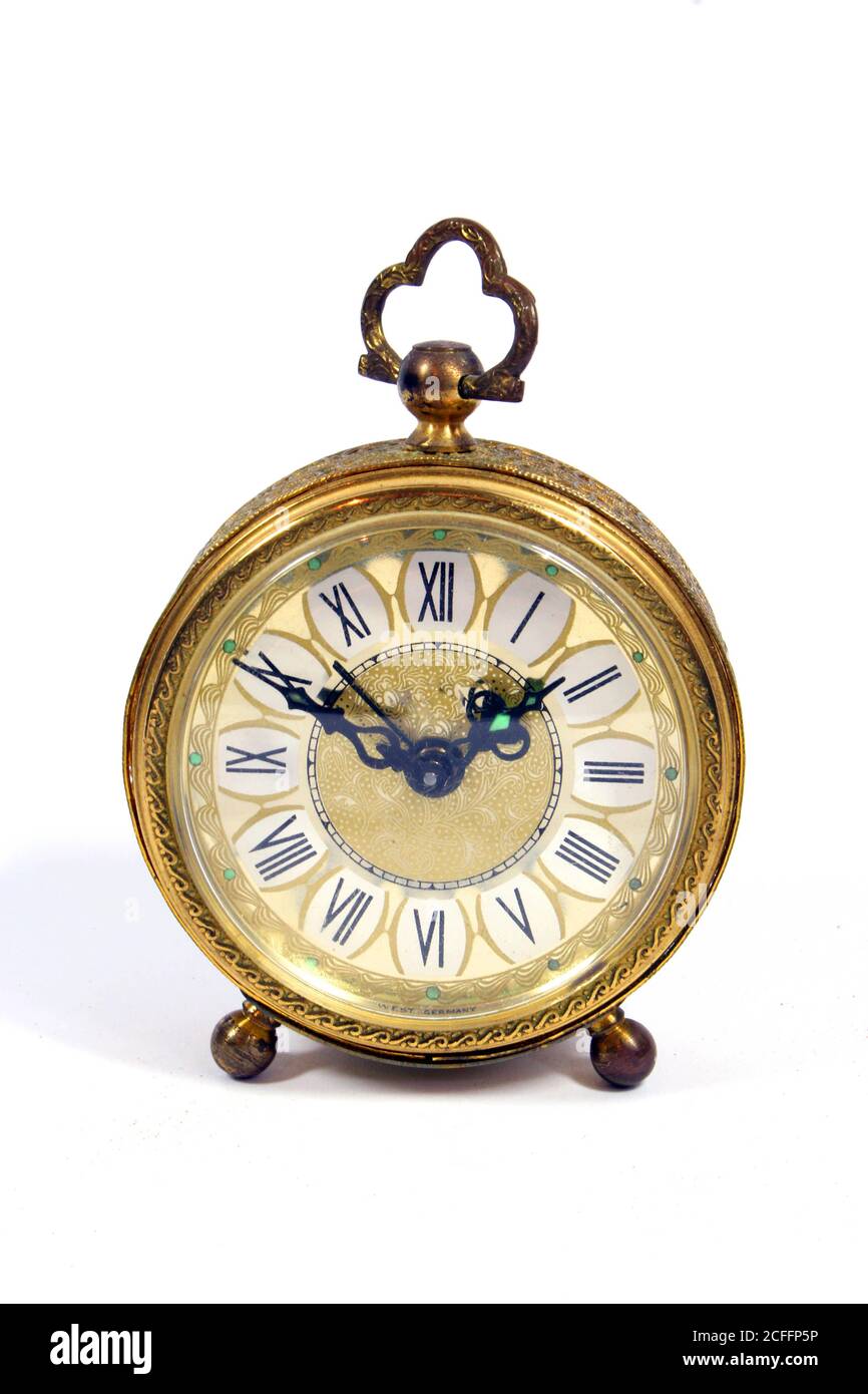 A Vintage Antique Desk Clock on White Background Stock Photo - Alamy