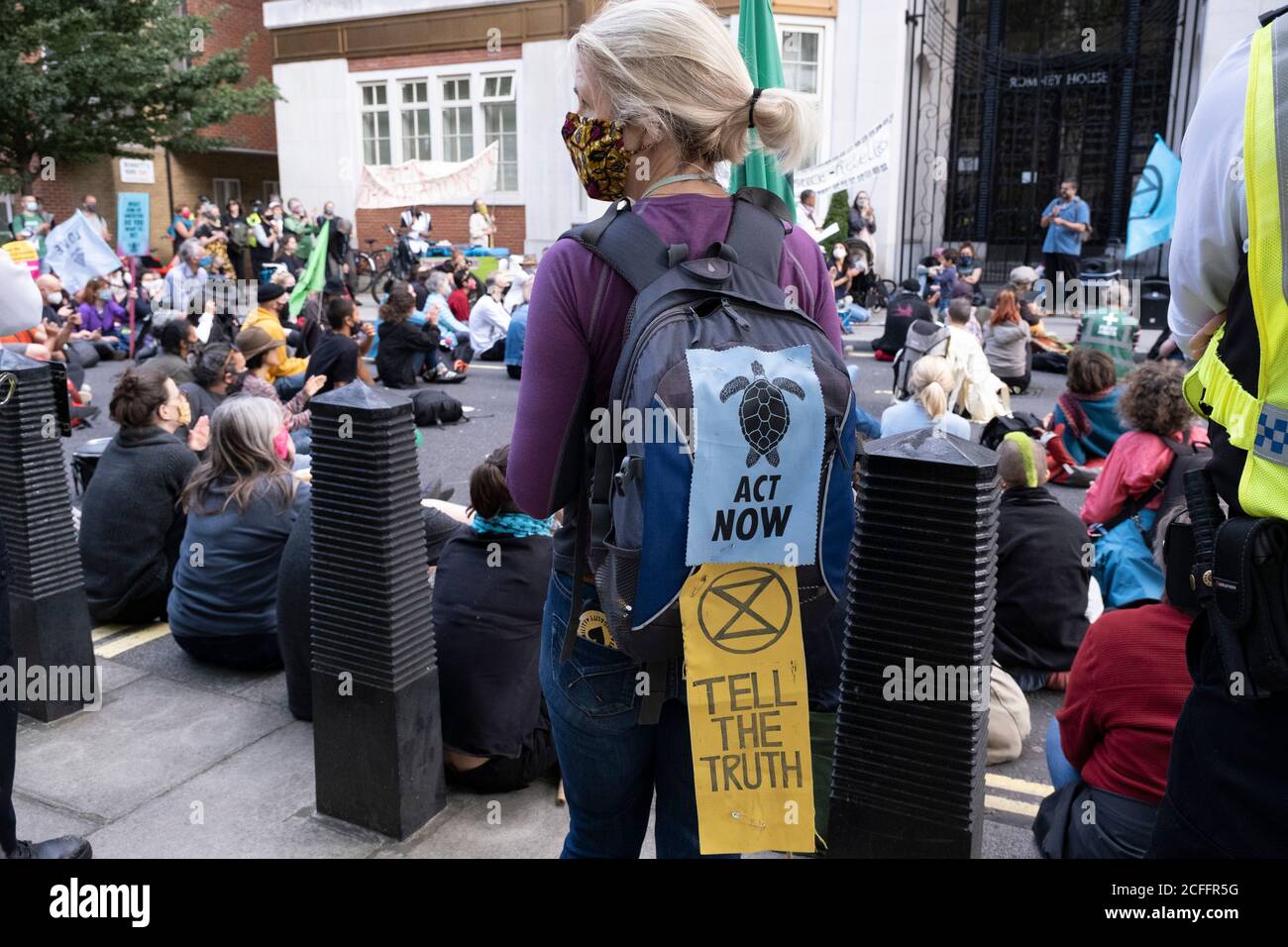 Climate justice is migrant justice protesters at an Extinction Rebellion demonstration gathering outside the Home Office in solidarity with migrants and those who suffer because of migration systems wordwide on 4th September 2020 in London, United Kingdom. With government resitting after summer recess, the climate action group has organised two weeks of events, protest and disruption across the capital. Extinction Rebellion is a climate change group started in 2018 and has gained a huge following of people committed to peaceful protests. These protests are highlighting that the government is n Stock Photo