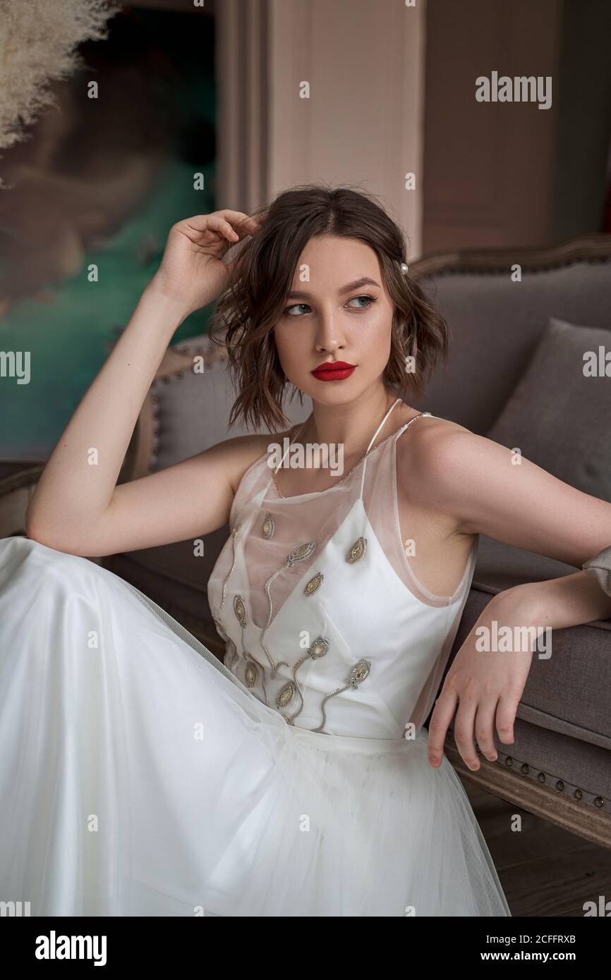 white dress red lips Angelina Jolie's angelic white dress and vibrant red lipstick