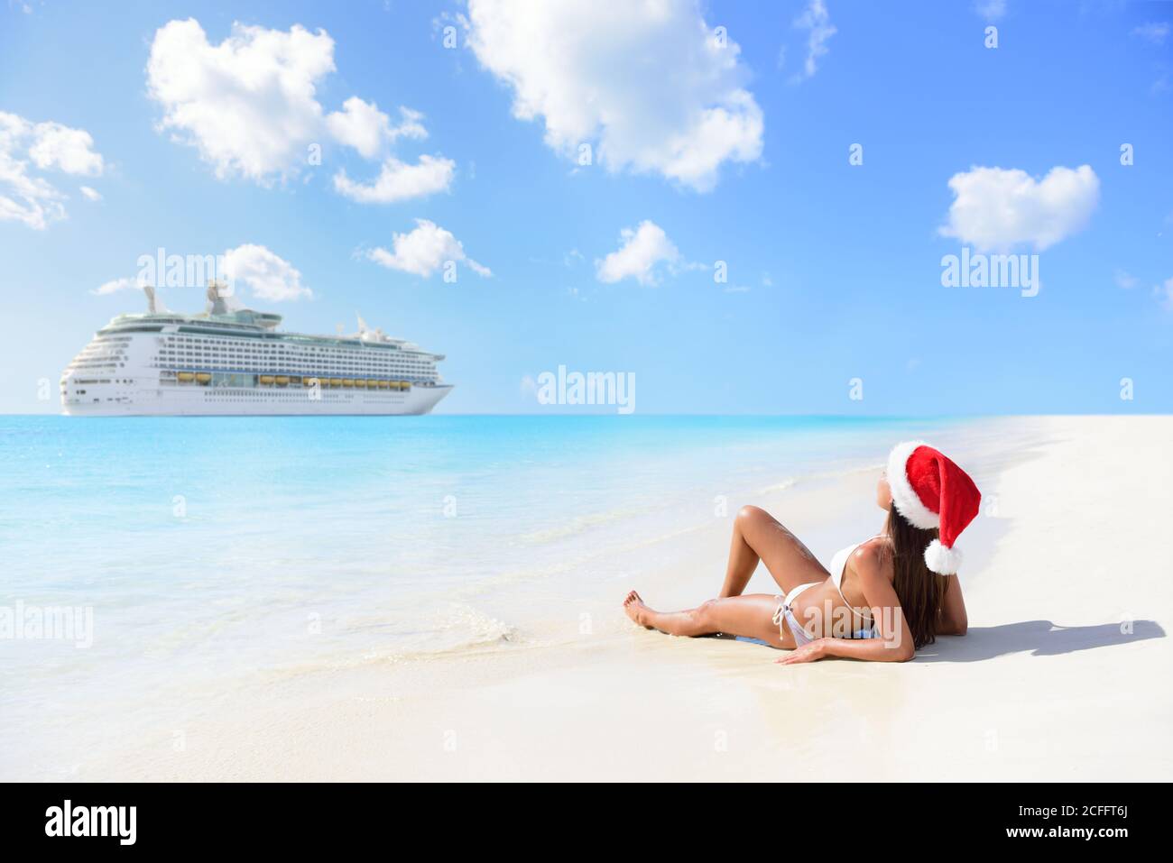 Christmas cruise travel - woman tanning on beach Stock Photo