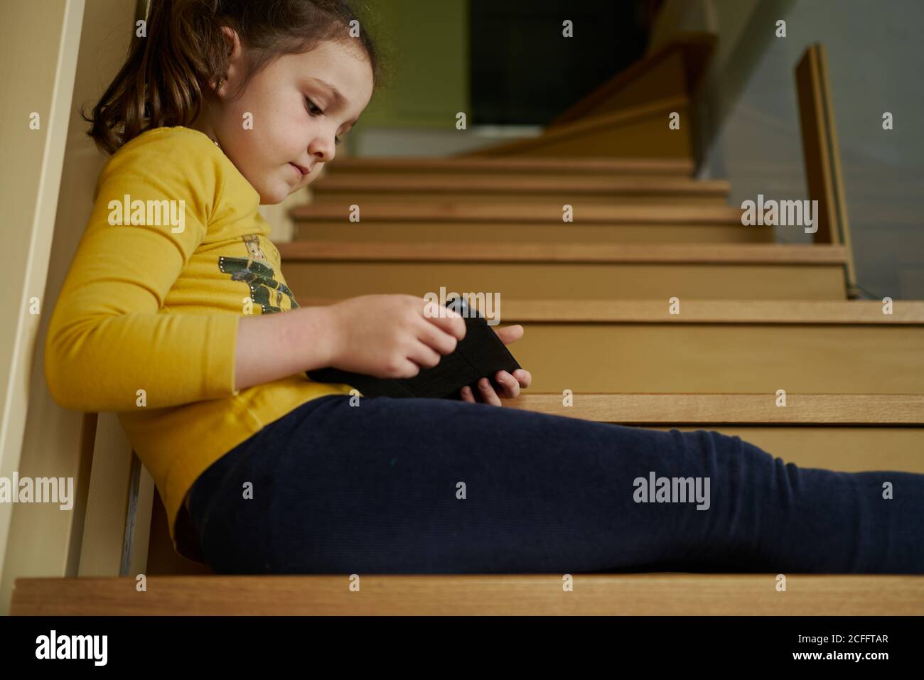Girl Sitting On Stairs High Resolution Stock Photography and Images - Alamy