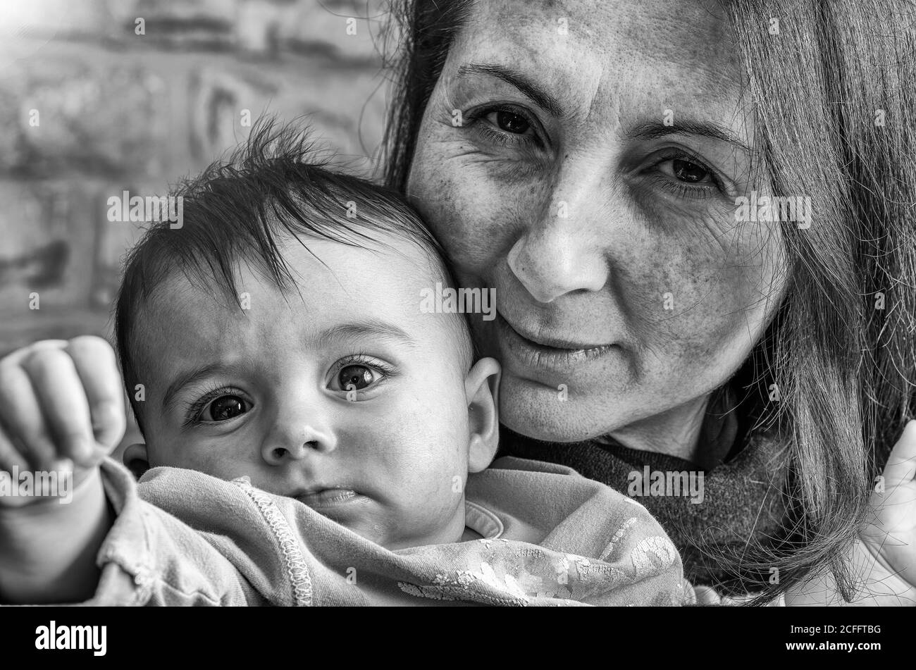 Happy mother holding her daughter at home. Family concept. Stock Photo