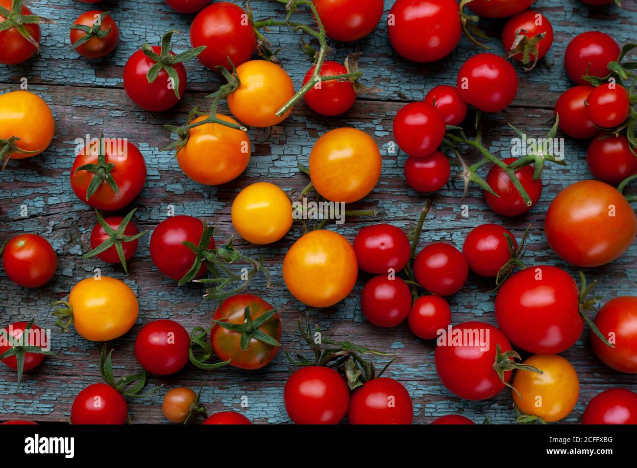 Red and yellow cherry tomatoes top view. Harvest vegetables. Tomato on