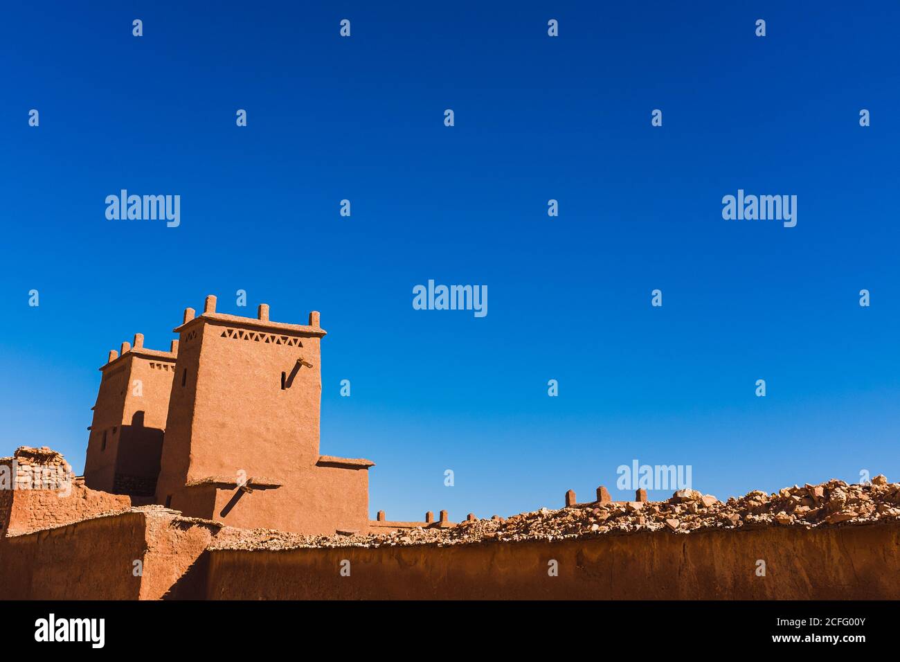 Magnificent scenery of facade of ancient clay buildings and walls in Ait Ben Haddou on sunny day Stock Photo