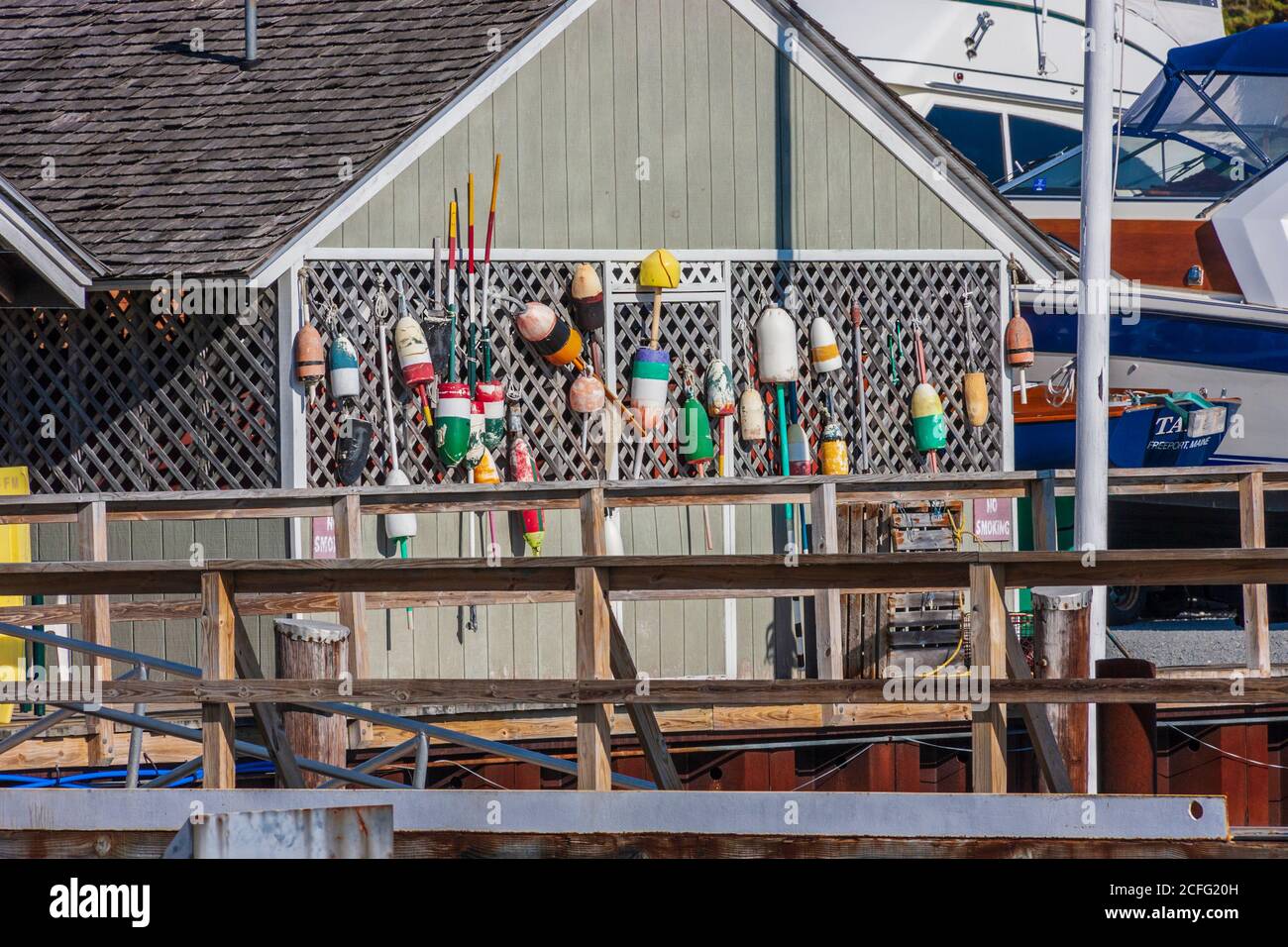 Freeport Town Wharf area at South Freeport harbor, South Freeport, Maine. Fishing boats and fishing gear abound in this quintessential Maine wharf. Stock Photo