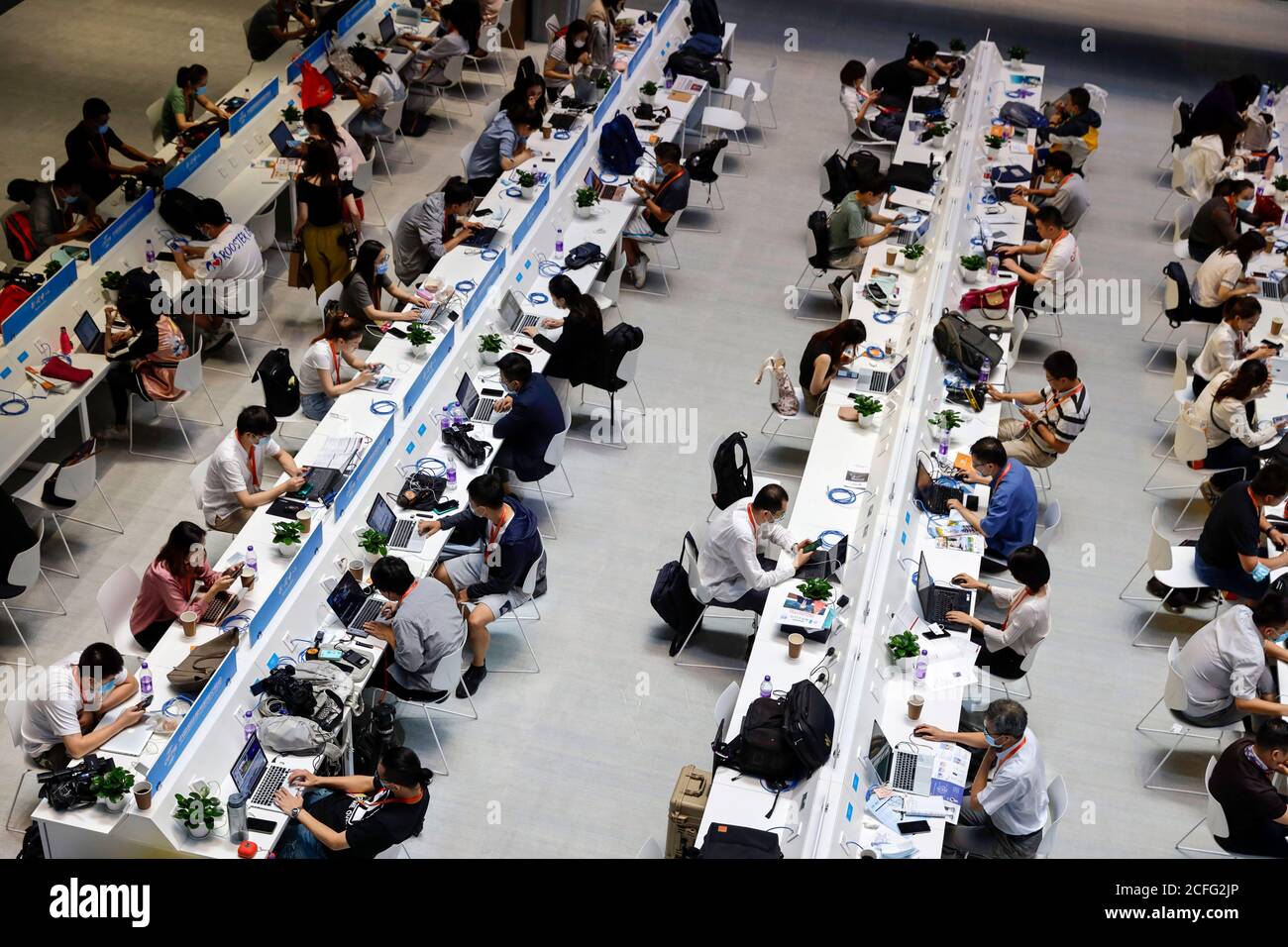 Beijing, China. 5th Sep, 2020. Reporters work at the media center of the 2020 China International Fair for Trade in Services (CIFTIS) in Beijing, capital of China, Sept. 5, 2020. The CIFTIS runs on Sept. 4-9 in Beijing. Credit: Li Muzi/Xinhua/Alamy Live News Stock Photo