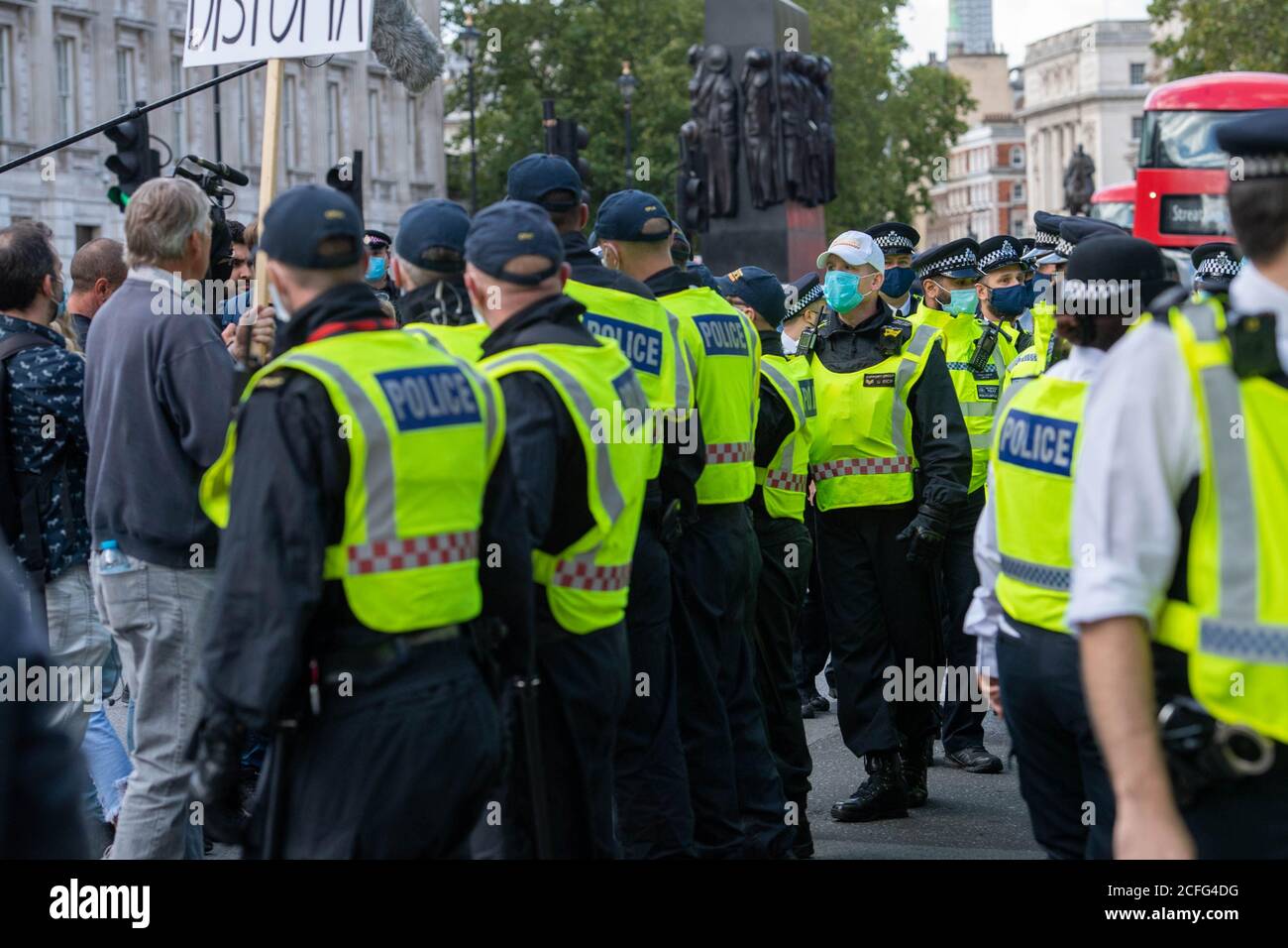 London 5th September 2020 A relatively peaceful 'Anti-Vaxx' rally outside Downing Street suddenly turned violent when police started to make arrests as the rally broke up. City of London public order police formed a cordon forcing everyone up Westminster towards the Houses of Parliament. Credit: Ian Davidson/Alamy Live News Stock Photo