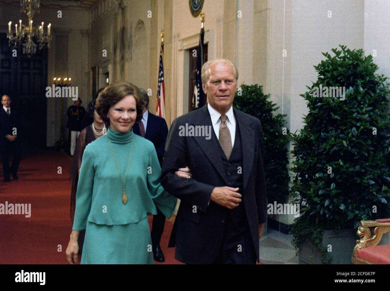 President Gerald Ford escorts Rosalynn Carter at the Panama Canal Treaty State Dinner. ca.  7 September 1977 Stock Photo