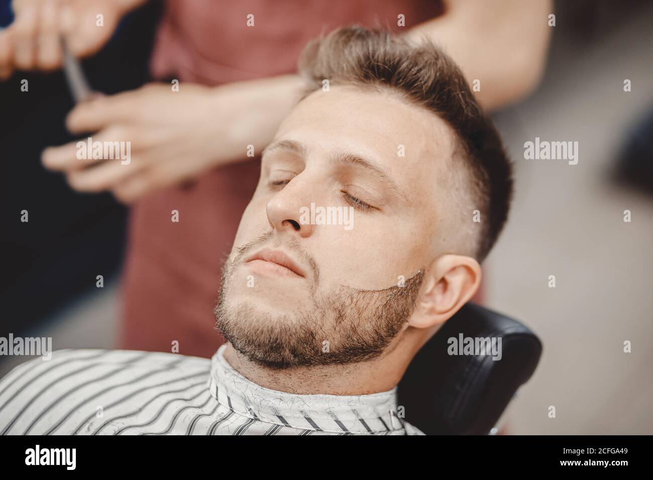 Barbershop haircut process barber trimming hi-res stock photography and ...