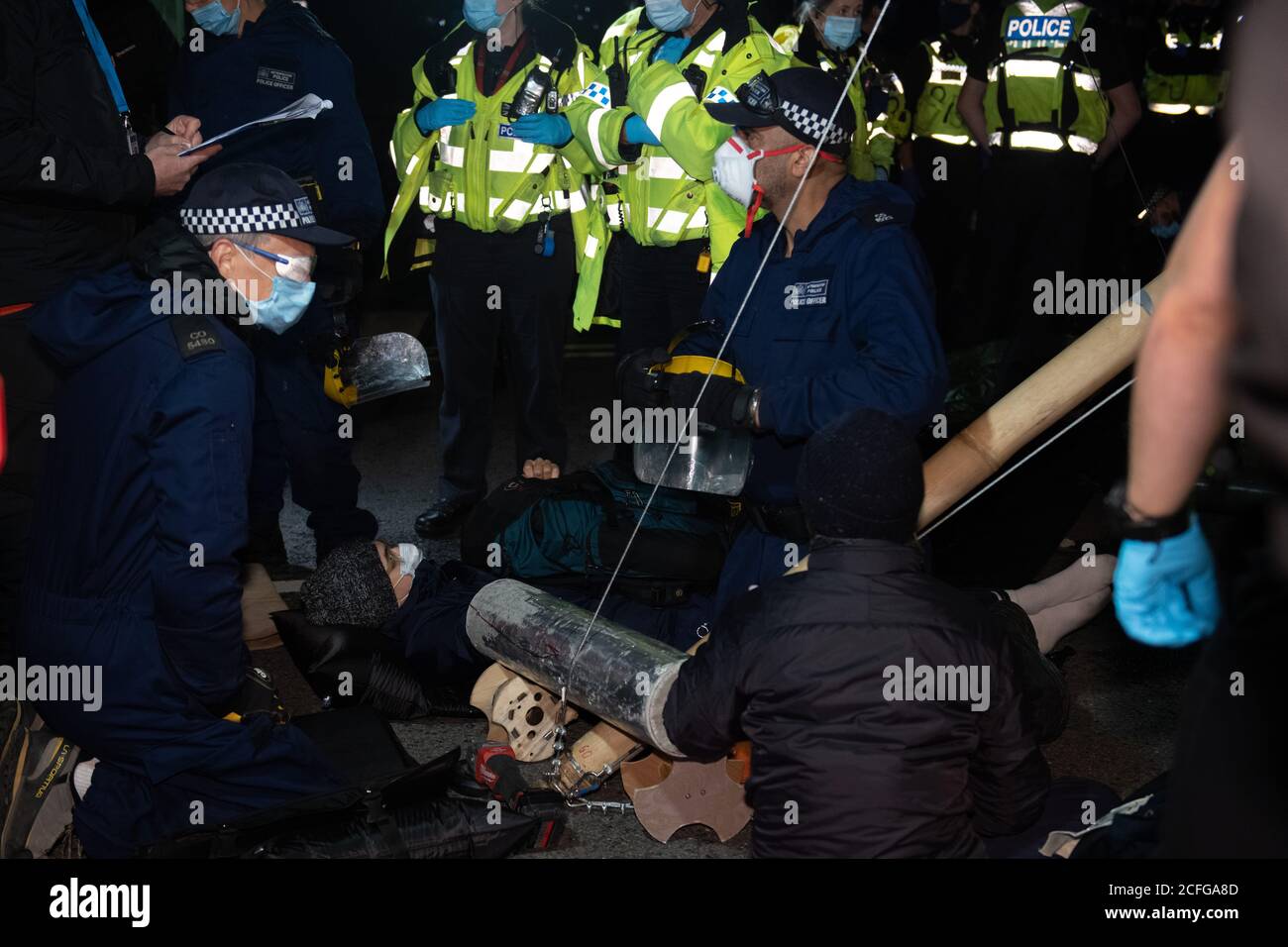 Extinction Rebellion carried out Non Violent Direct Action to blockade News International's printworks to protest ownership of UK by oligarchs and their failure to 'Tell The Truth' adequately report the scale of the Climate Crisis and their frequent support for Climate scepticism or denialism. Times, Telegraph, Sun, Mail & Evening Standard were all mostly unable to distribute print editions. Credit: Gareth Morris/Alamy Live News Stock Photo