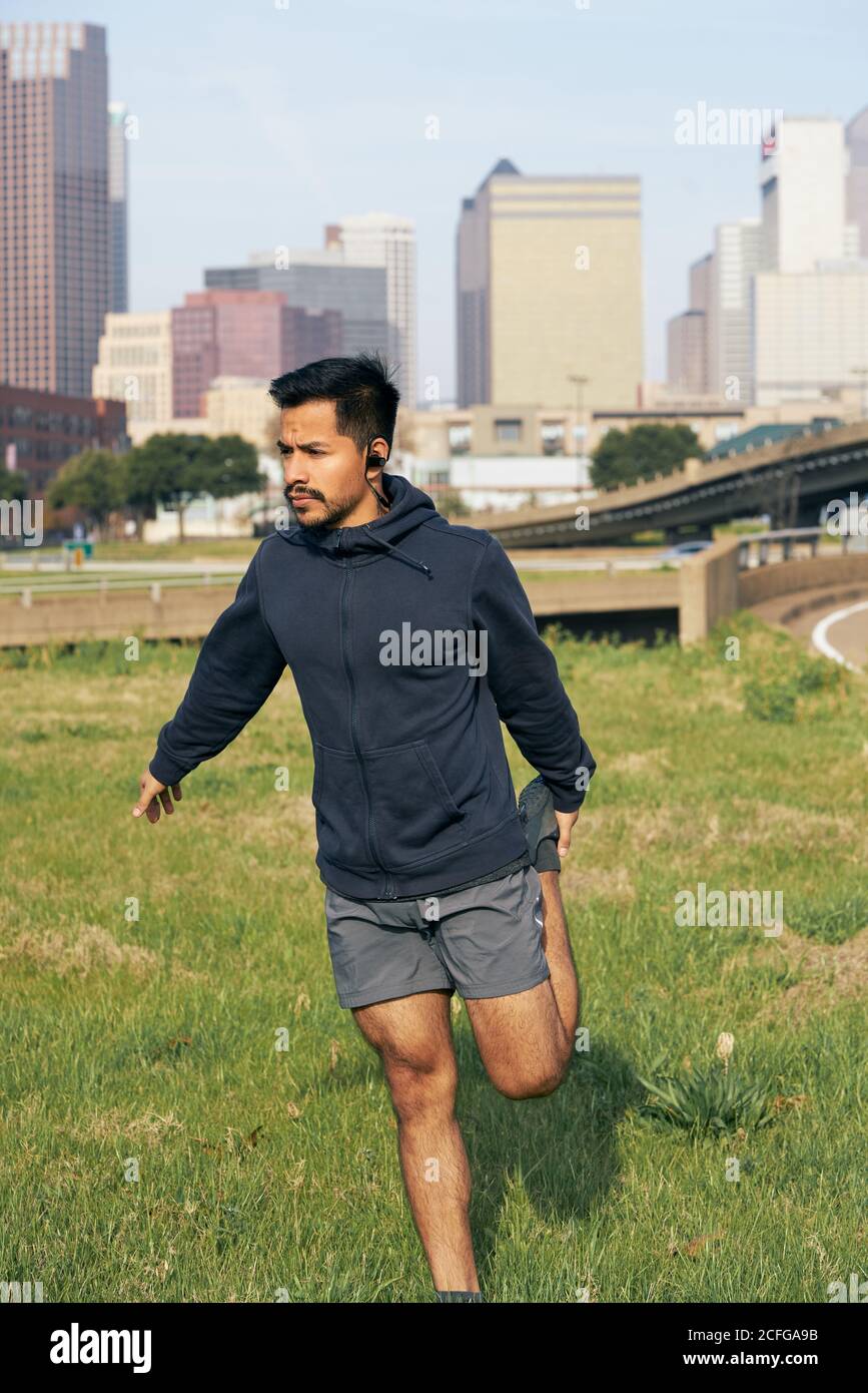 Young sporty man stretching hi-res stock photography and images - Alamy