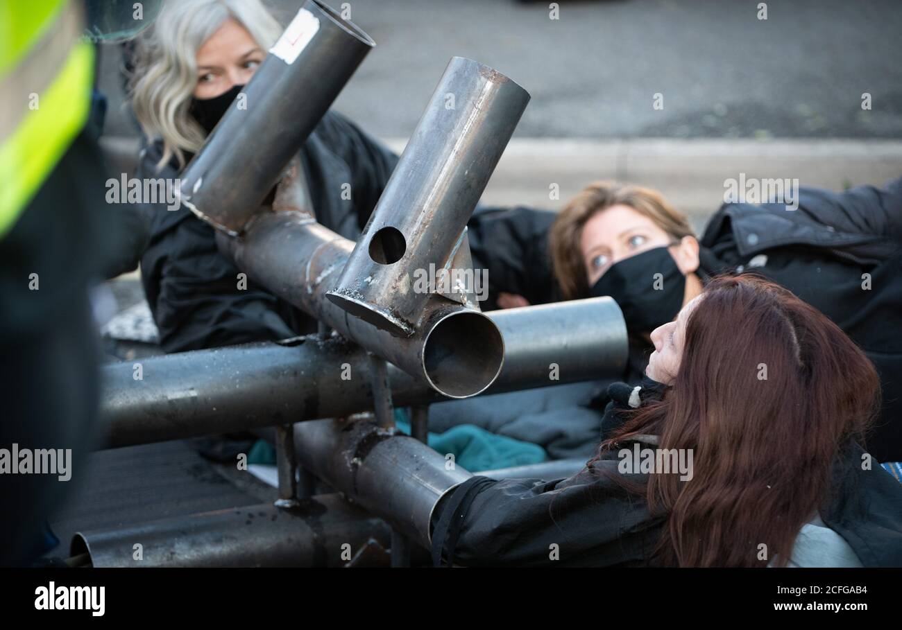 Extinction Rebellion carried out Non Violent Direct Action to blockade News International's printworks to protest ownership of UK by oligarchs and their failure to 'Tell The Truth' adequately report the scale of the Climate Crisis and their frequent support for Climate scepticism or denialism. Times, Telegraph, Sun, Mail & Evening Standard were all mostly unable to distribute print editions. Credit: Gareth Morris/Alamy Live News Stock Photo