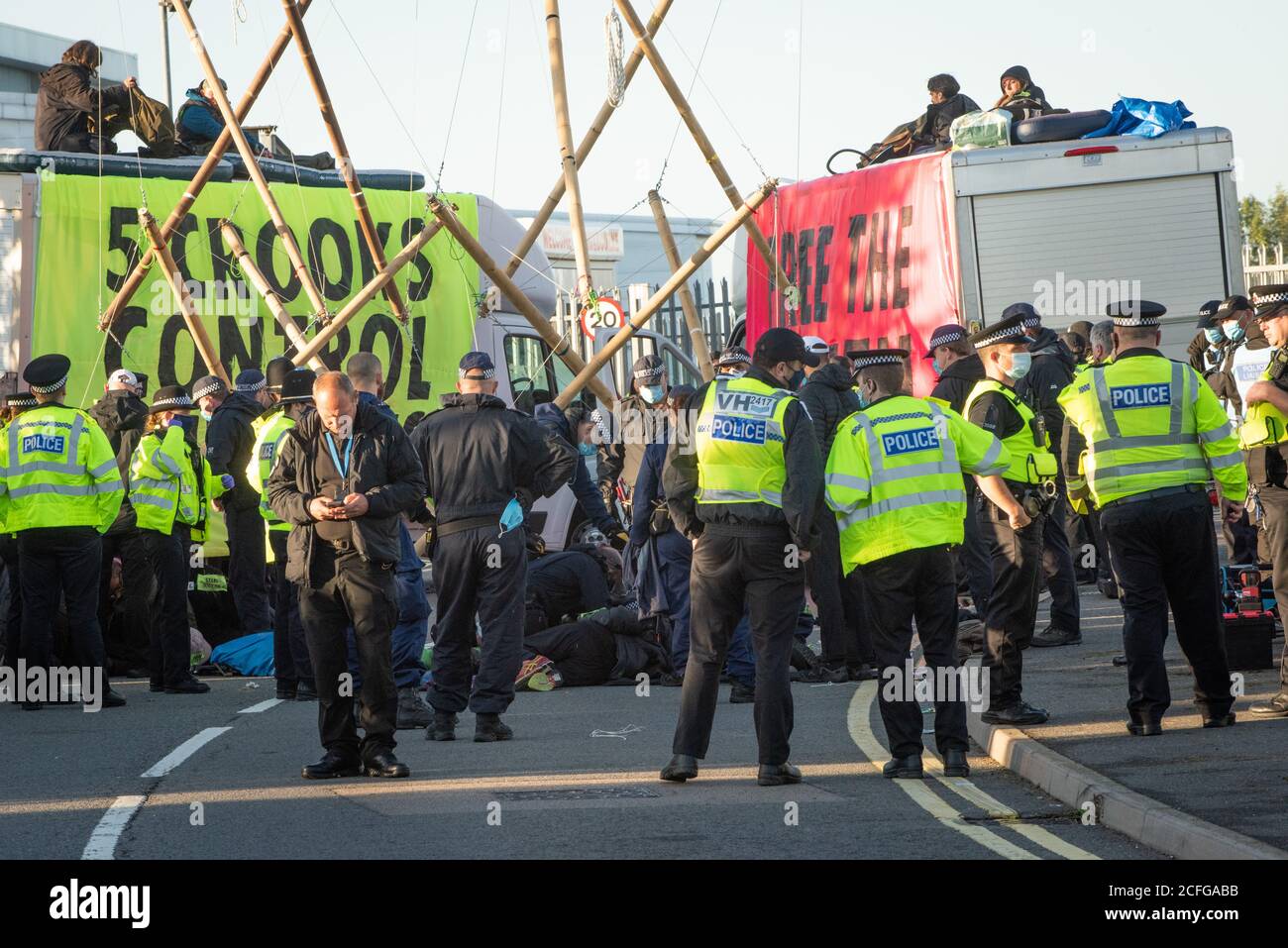 Extinction Rebellion carried out Non Violent Direct Action to blockade News International's printworks to protest ownership of UK by oligarchs and their failure to 'Tell The Truth' adequately report the scale of the Climate Crisis and their frequent support for Climate scepticism or denialism. Times, Telegraph, Sun, Mail & Evening Standard were all mostly unable to distribute print editions. Credit: Gareth Morris/Alamy Live News Stock Photo