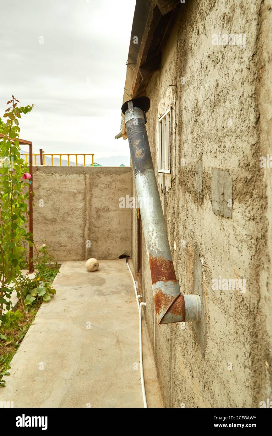 stainless steel exhaust pipe of an old house in the highlands of Asia Stock Photo Alamy