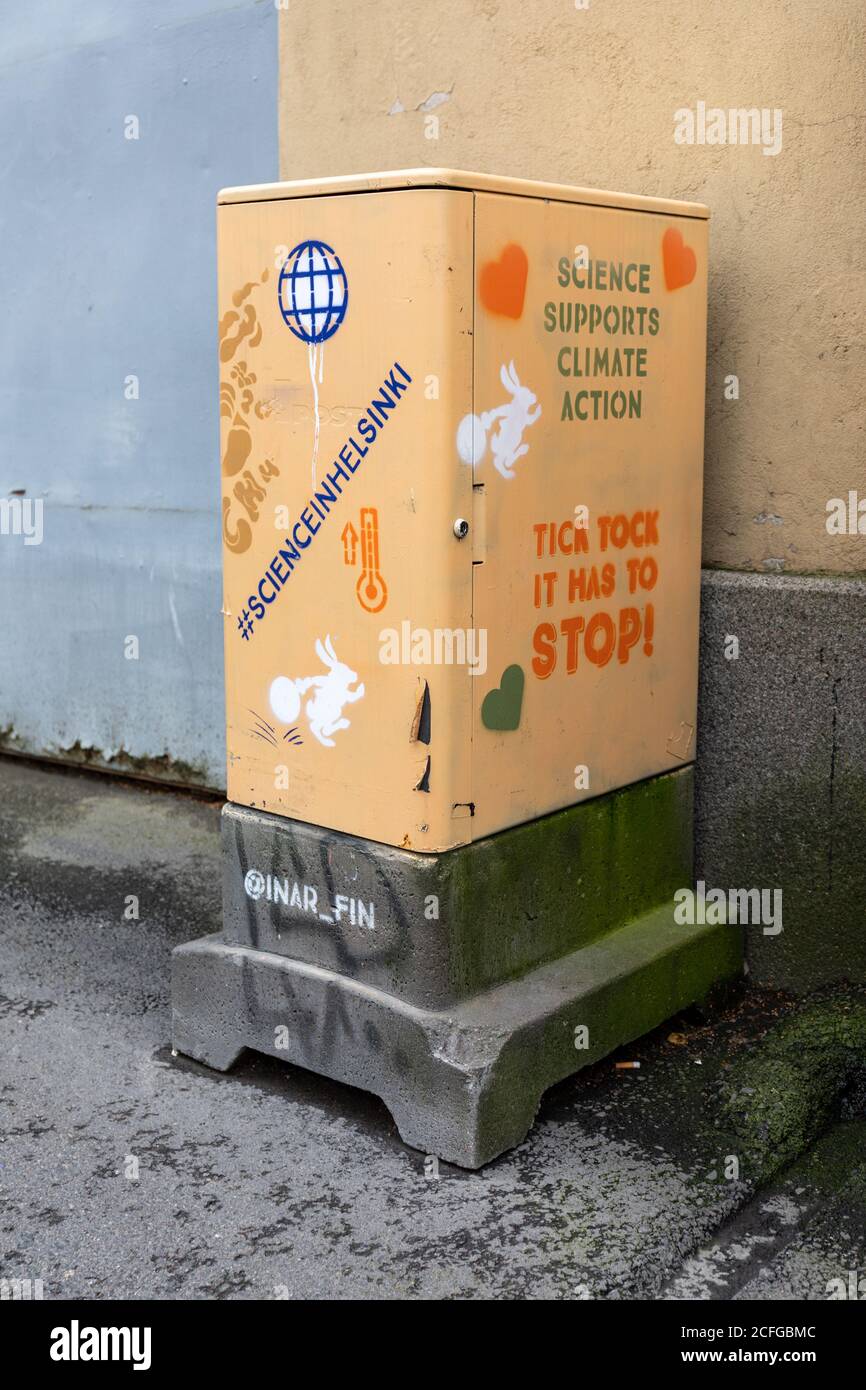 Post bundle cabinet with climate action message in Alppila district of Helsinki, Finland Stock Photo