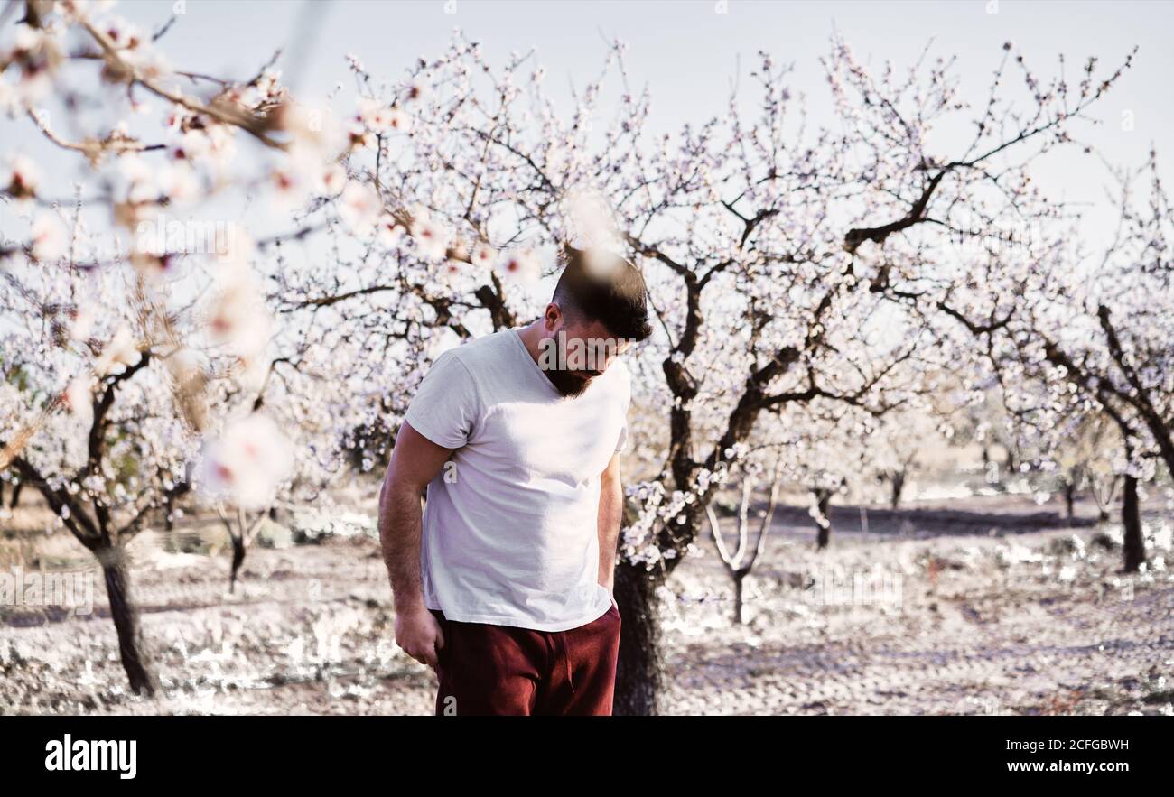 man doing yoga in spring garden Stock Photo