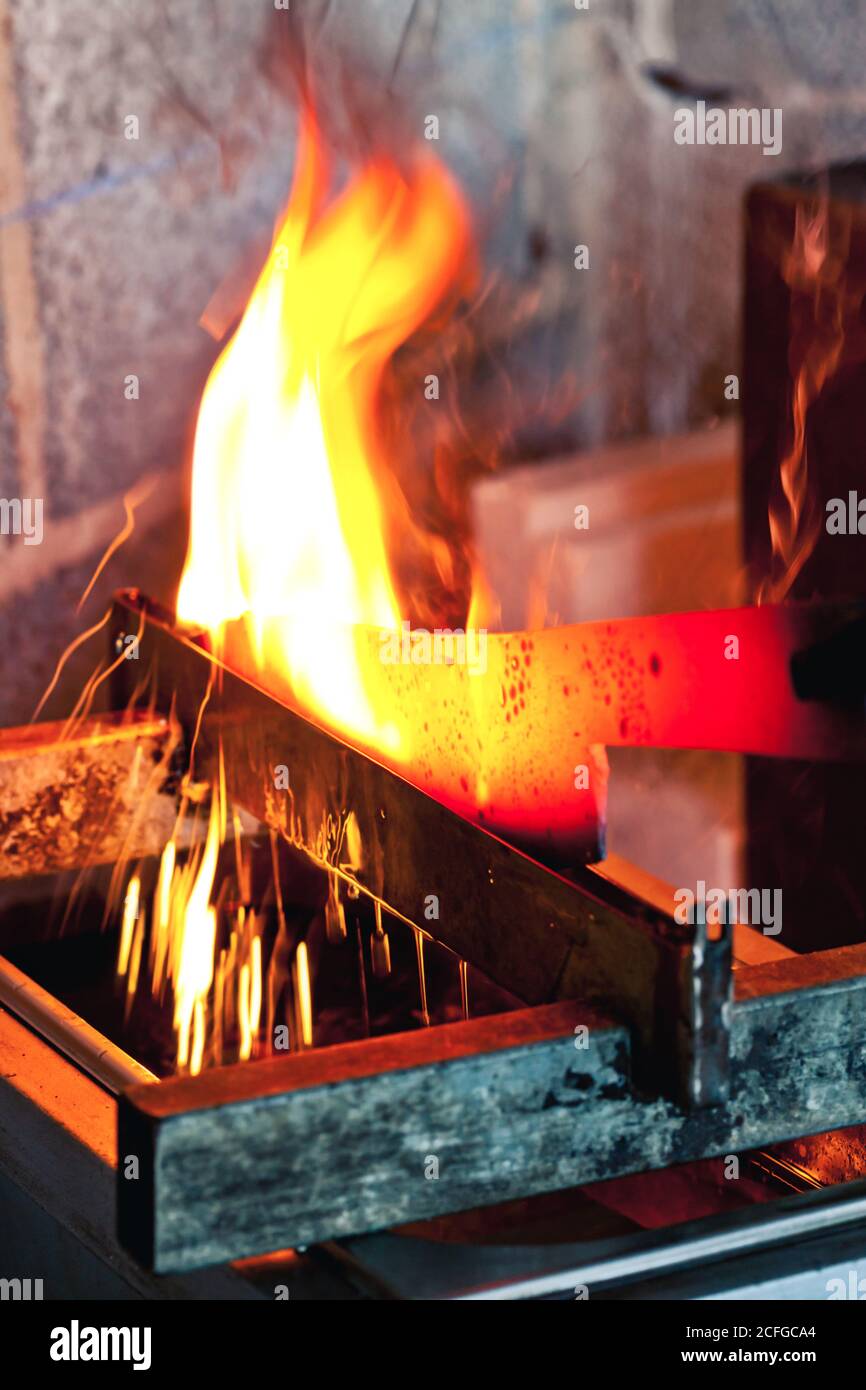 Knife blank on burning fire Stock Photo Alamy