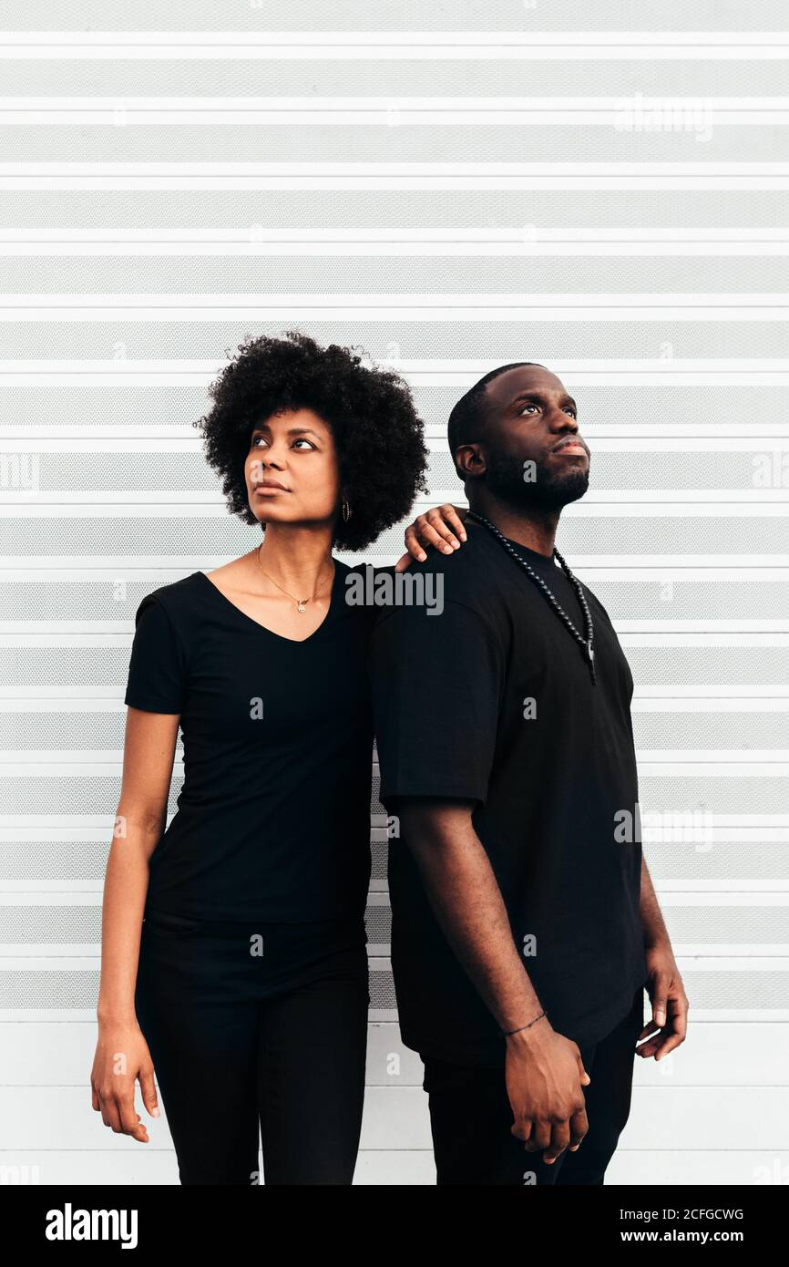 Black cool couple posing over white background looking at camera Stock Photo