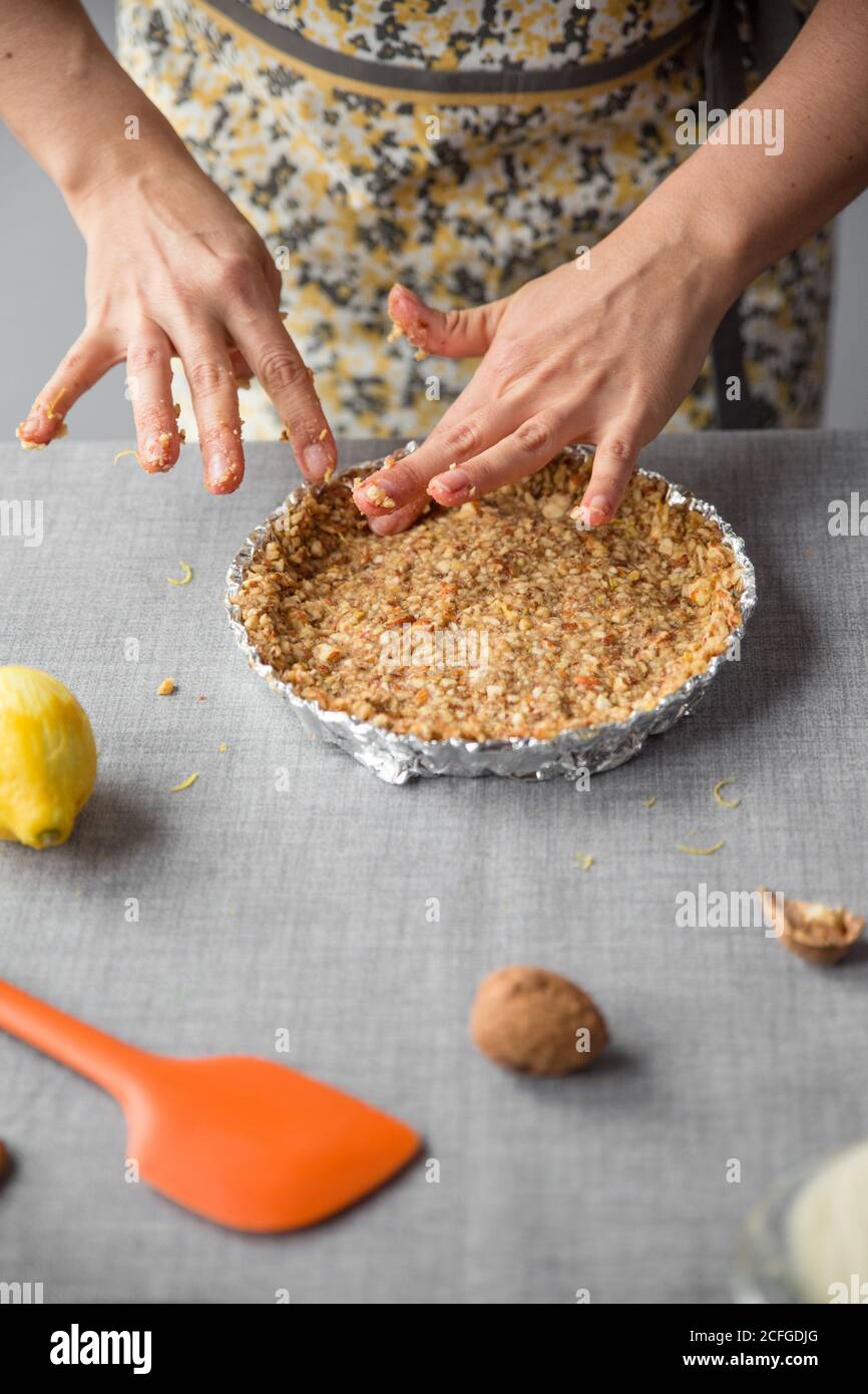 Woman putting the mixture in a container Stock Photo - Alamy