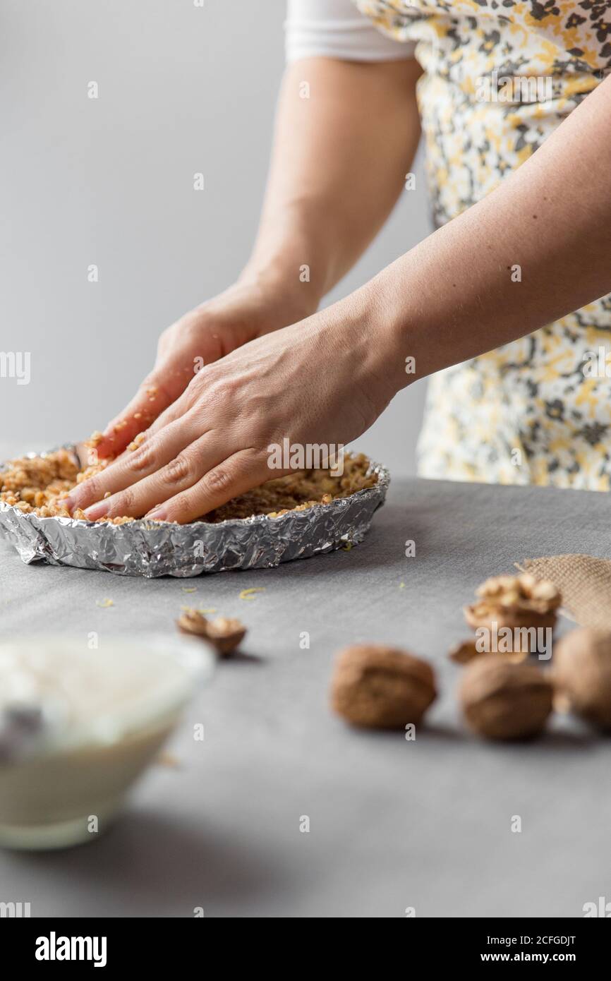 Woman putting the mixture in a container Stock Photo - Alamy