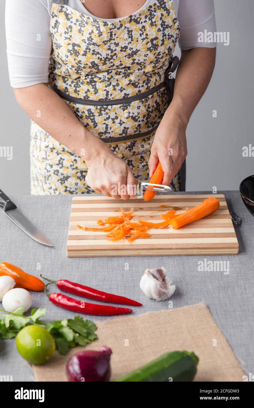 Woman peeling onion close up hi-res stock photography and images - Alamy