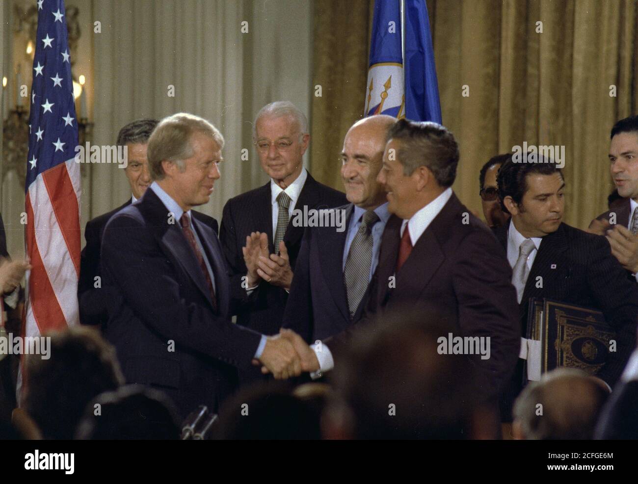 Jimmy Carter and General Omar Torrijos shake hands after signing the Panama Canal Treaty. ca.  09/07/1977 Stock Photo