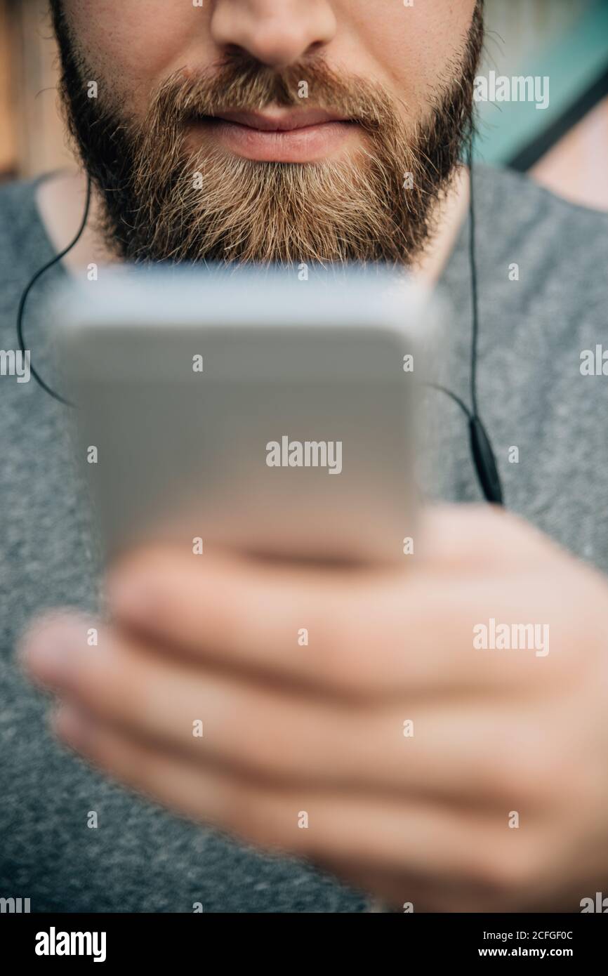Bearded man using a phone Stock Photo