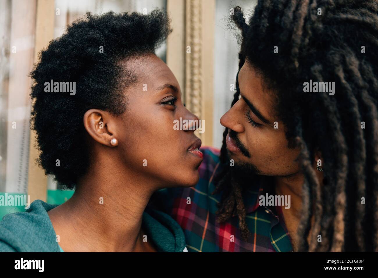 Mixed race couple kissing Stock Photo