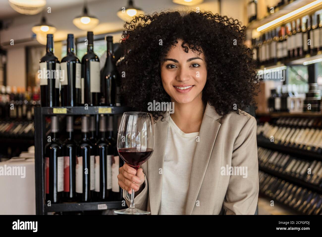 Woman holding glass of wine hi-res stock photography and images - Alamy