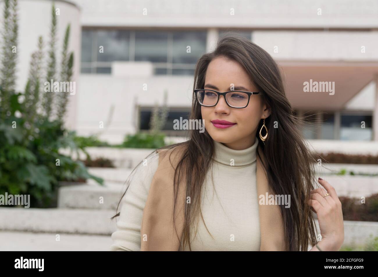 Pretty Woman in glasses looking away Stock Photo