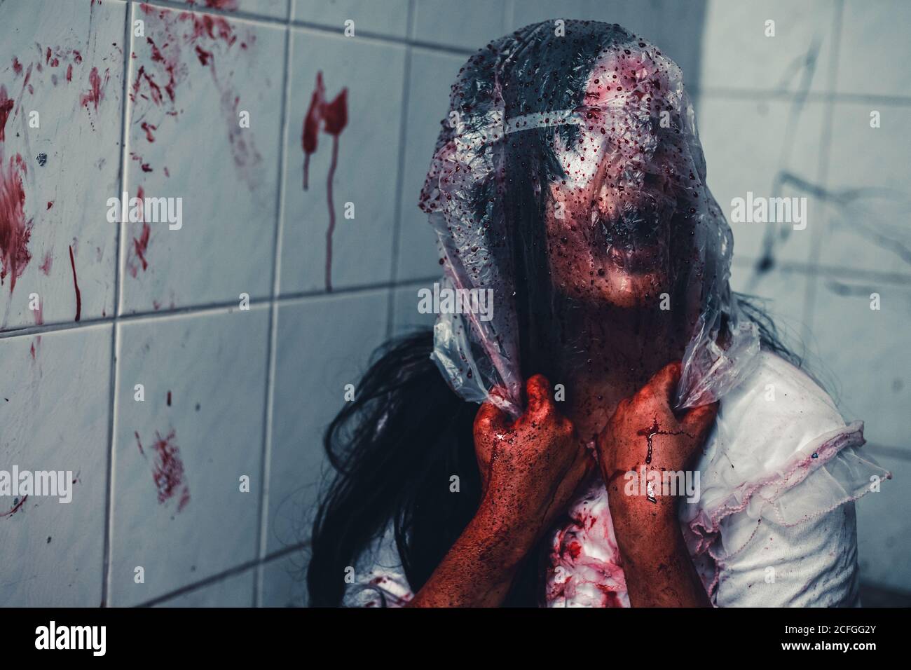 horror scence of woman cover the plastic bag in head in toilet at abandoned  house.Ghost women wear white dress stain blood. Halloween concept Stock  Photo - Alamy