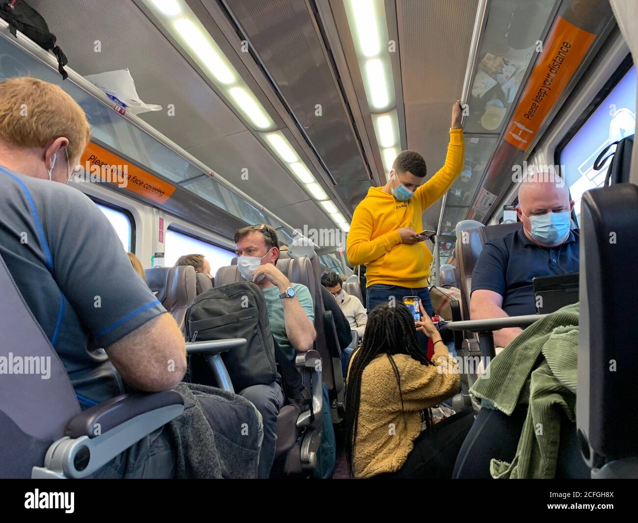 An over crowded Grand Central Trains (2020) heading towards London. The Train Company Grand Central were unable to deliver social distancing in the first class carriage of the london bound train on the 31st August 2020. Stock Photo