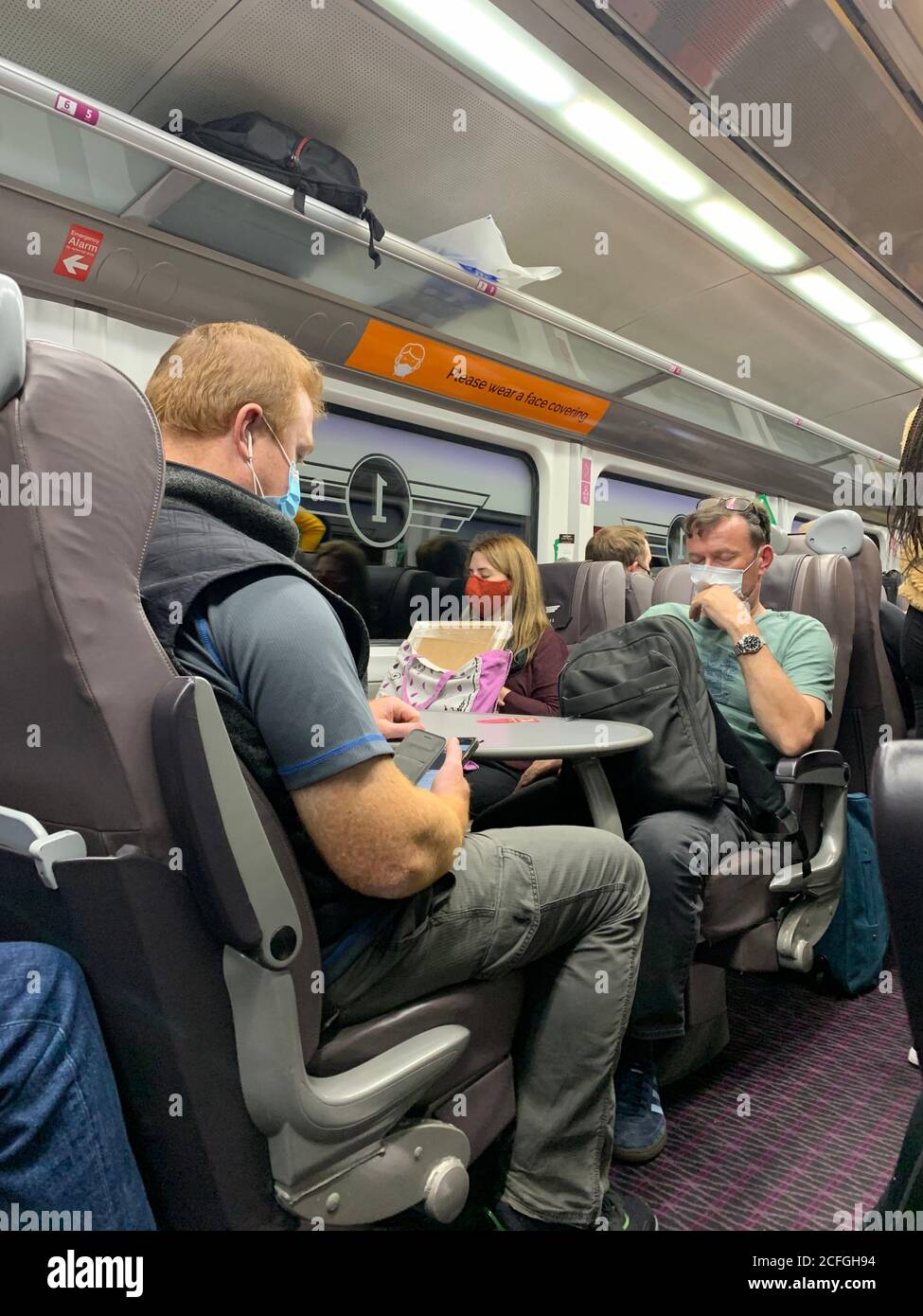 An over crowded Grand Central Trains (2020) heading towards London. The Train Company Grand Central were unable to deliver social distancing in the first class carriage of the london bound train on the 31st August 2020. Stock Photo