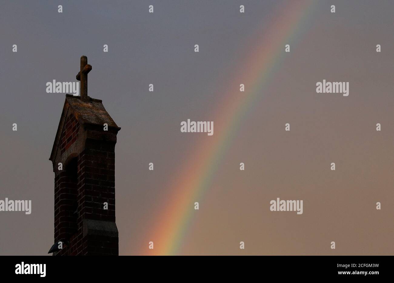 Loughborough, Leicestershire, UK. 5th September 2020. UK weather. A rainbow forms behind the Good Shepherd Church after rainfall at dusk. Credit Darren Staples/Alamy Live News. Stock Photo