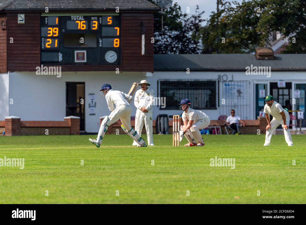 Cricket being played in Chalkwell Park, Westcliff on Sea, Southend, Essex, UK. Leigh on Sea Cricket Club batsman batting Stock Photo