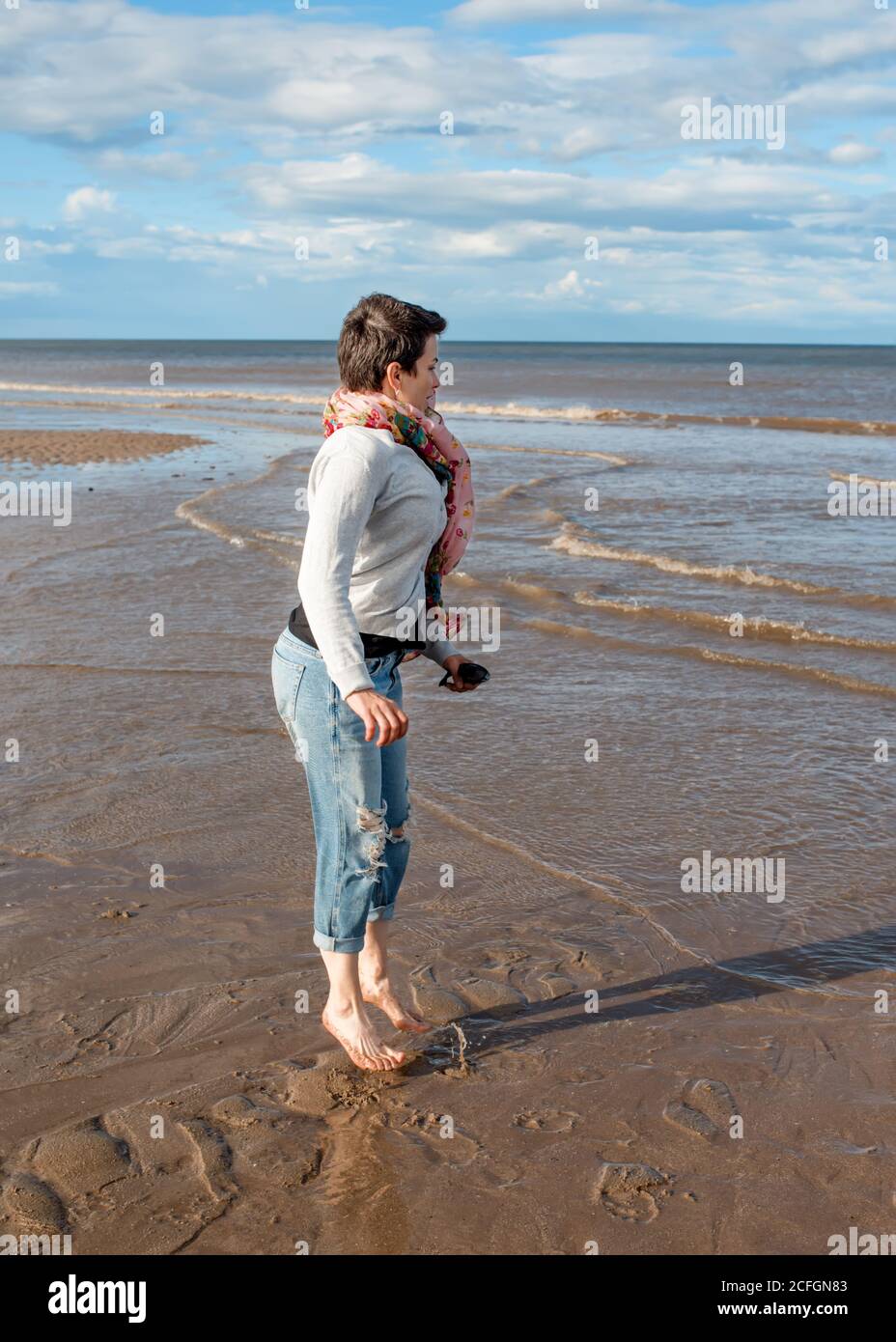 Barefoot woman jeans hi-res stock photography and images - Alamy