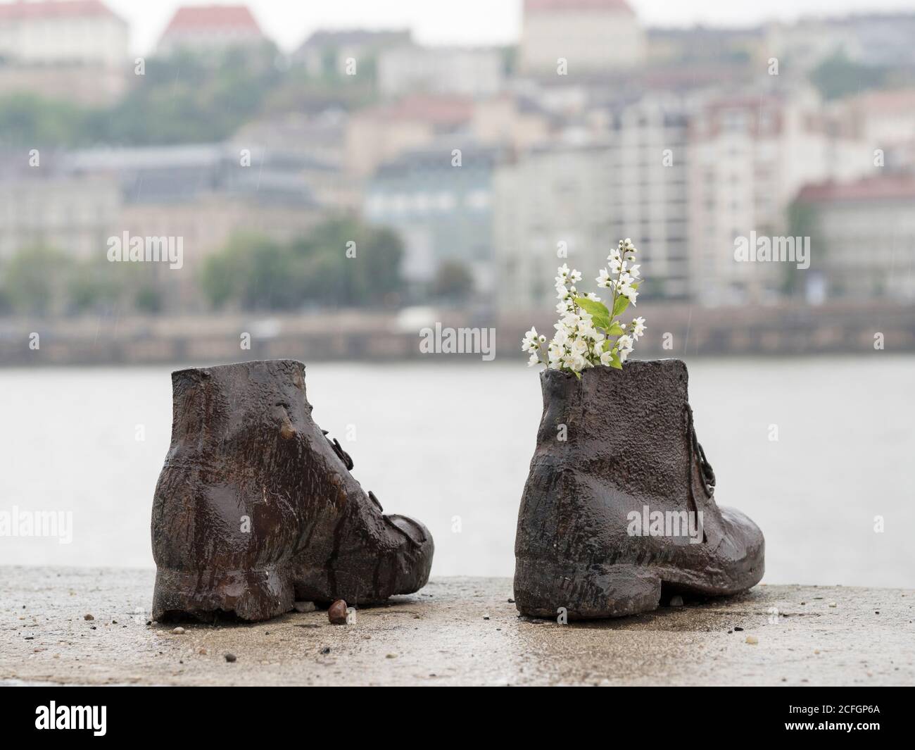 Detail from an iron sculpture of shoes along the Danube embankment. It is in memory of the victims shot into the Danube by Arrow Cross militiamen in 1944–45. Concieved by Can Togay and sculpted and erected 16 April 2005 by Gyula Pauer. Stock Photo