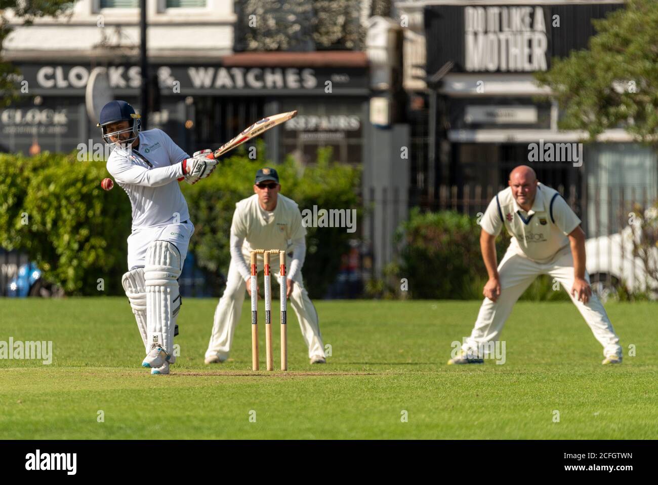 Cricket being played in Chalkwell Park, Westcliff on Sea, Southend, Essex, UK. Belhus Cricket Club batsman batting, with slips fielding Stock Photo