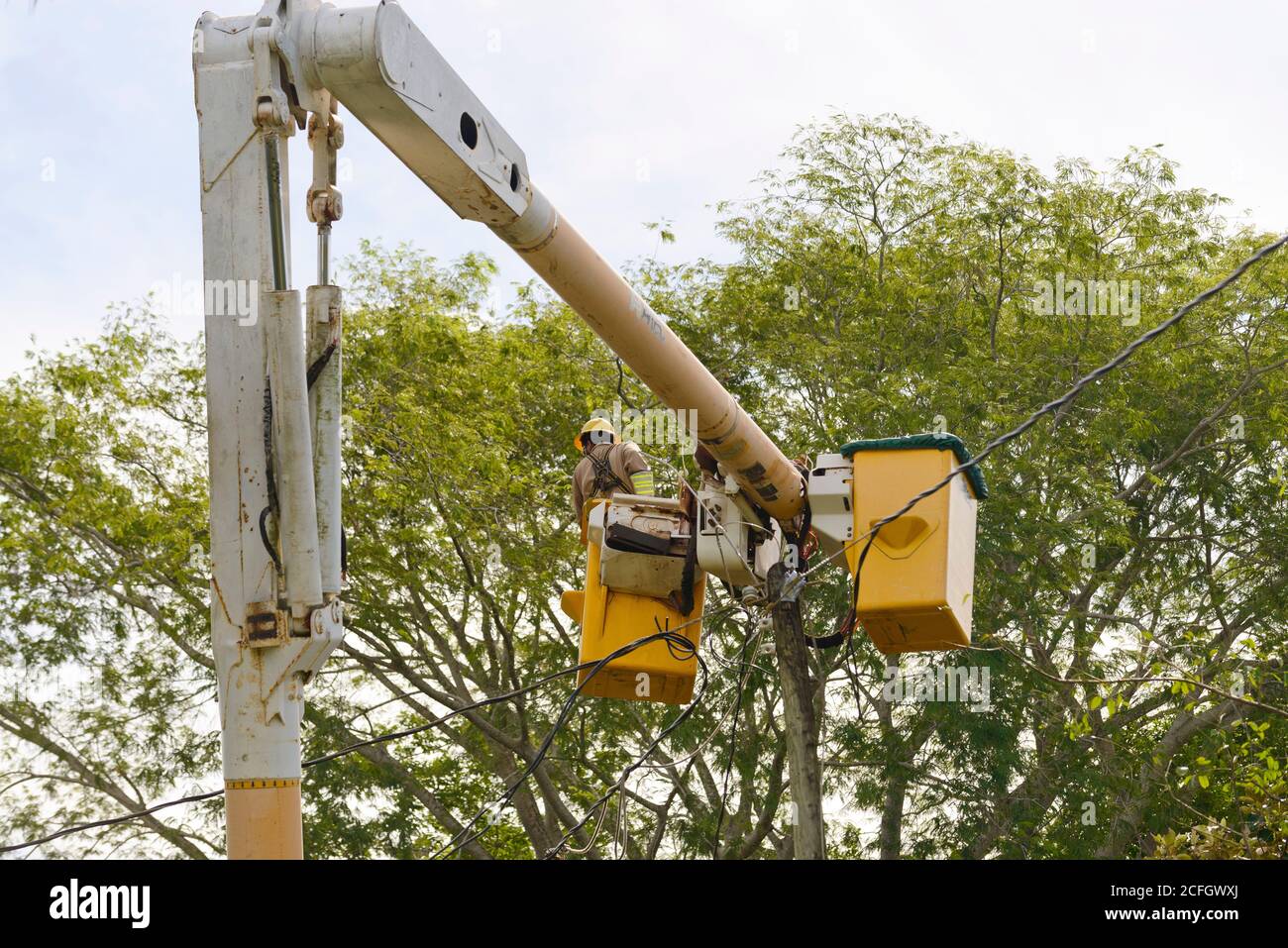 Sittee River Village, Stann Creek District, Belize - September 04, 2020: Belize Elictricity Limited crews carry ou repairs to power lines in the aftermath of hurricane NaNa Stock Photo