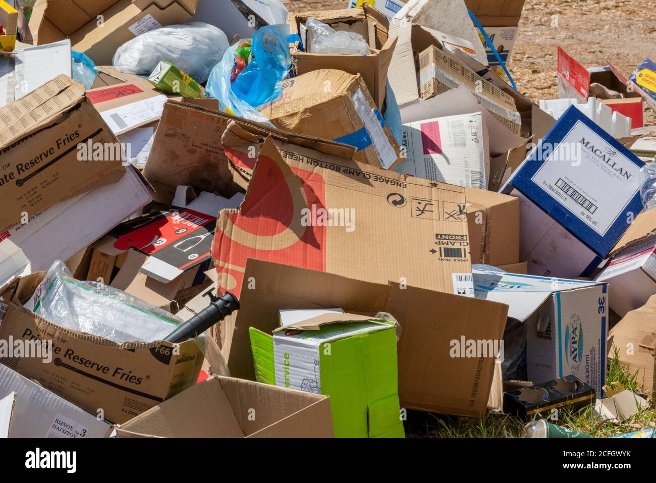 a pile of cardboard and rubbish boxes for recycling in a heap for waste