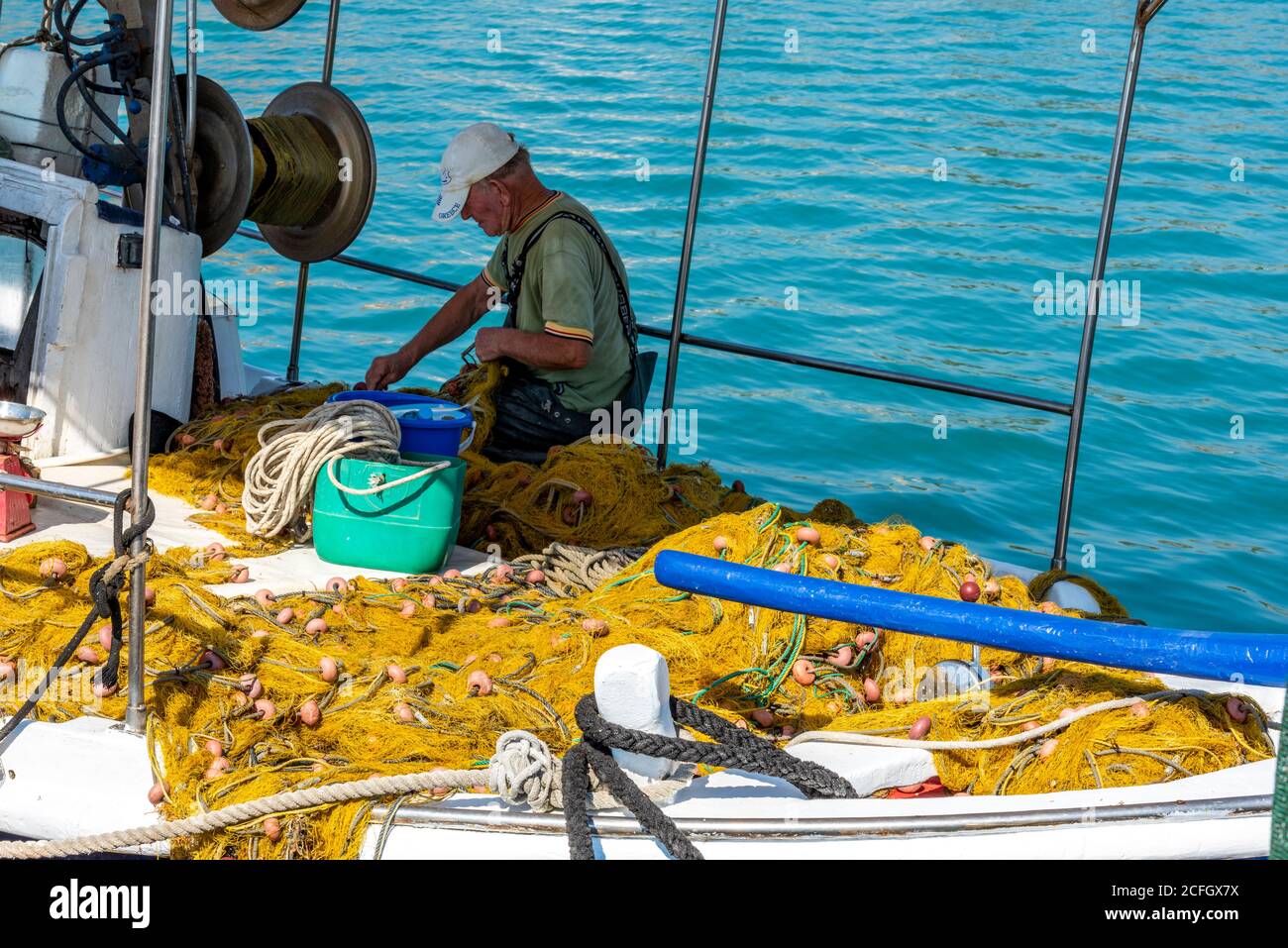Fishing port men mending nets hires stock photography and images Alamy